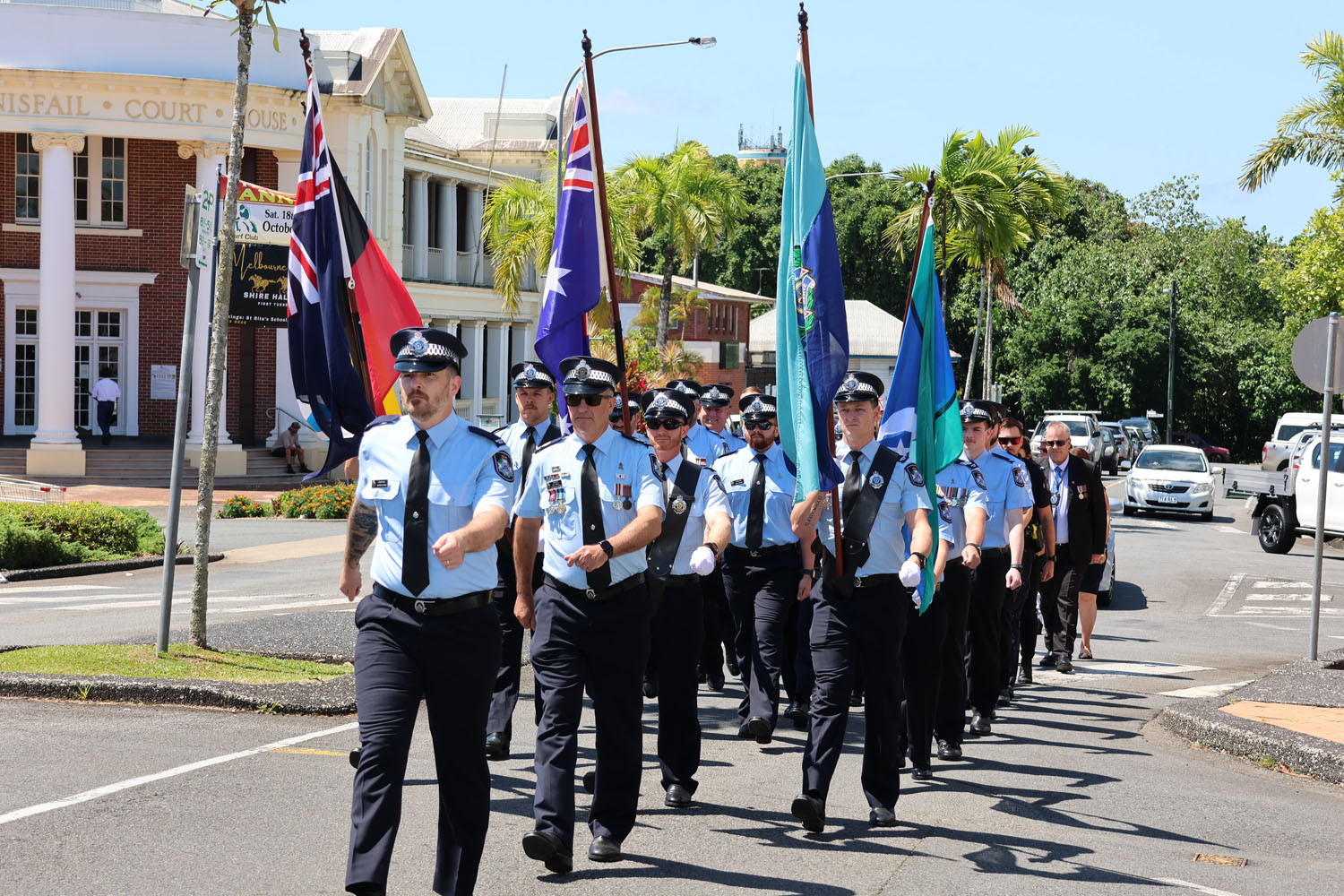 Casssowary Coast Patrol Group and local police march as a show of respect for their fallen colleagues in Innisfail. Picture: Supplied