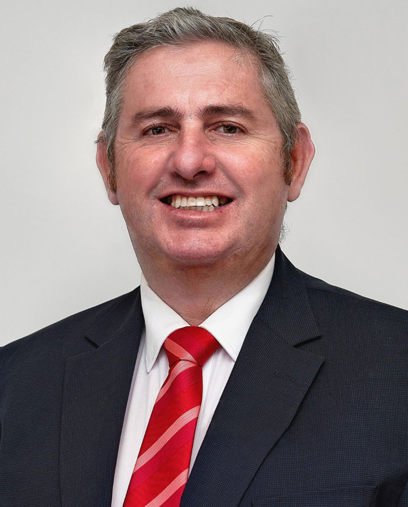 The Raine and Horne office in Innisfail principal Michael Skuse celebrate four years of leading the team in Innisfail. Pictures: Supplied